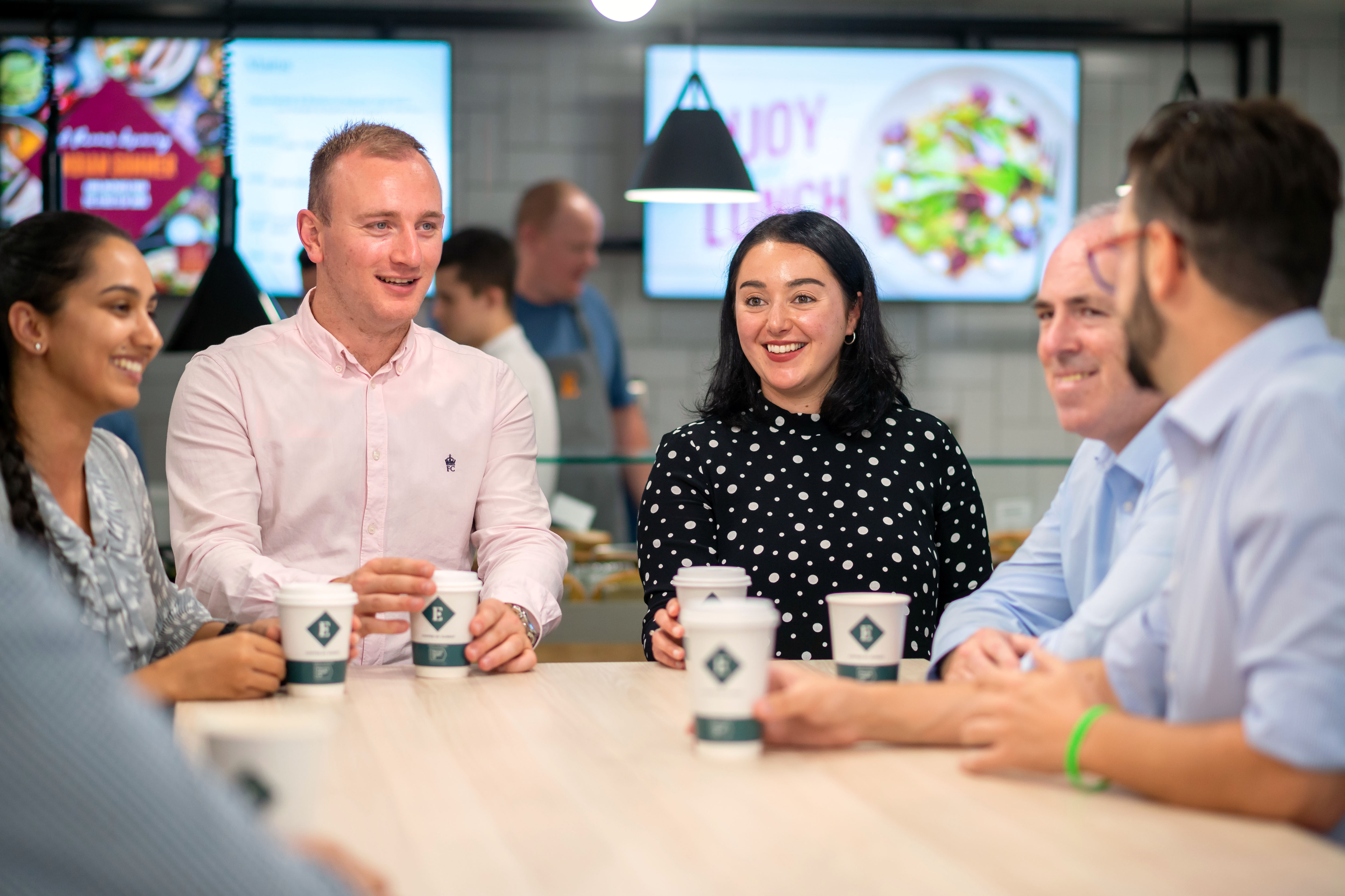 employees enjoying coffee served by contract caterers