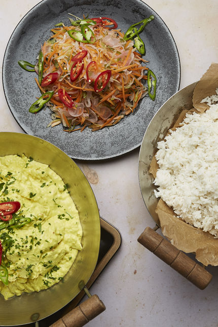 curry, rice, and coleslaw being served as part of corporate catering